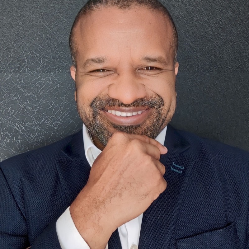 Headshot of Chris Folayan